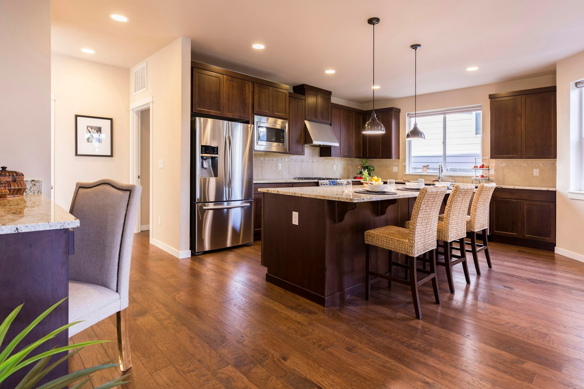 Custom dark walnut kitchen with brass hardware